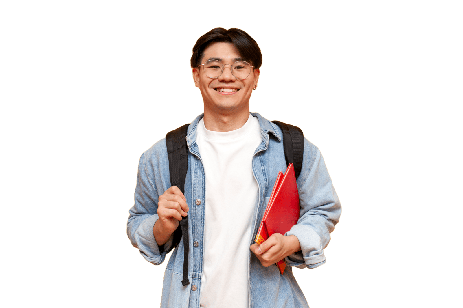 university student smiling with books in one hand while holding backpack strap with the other