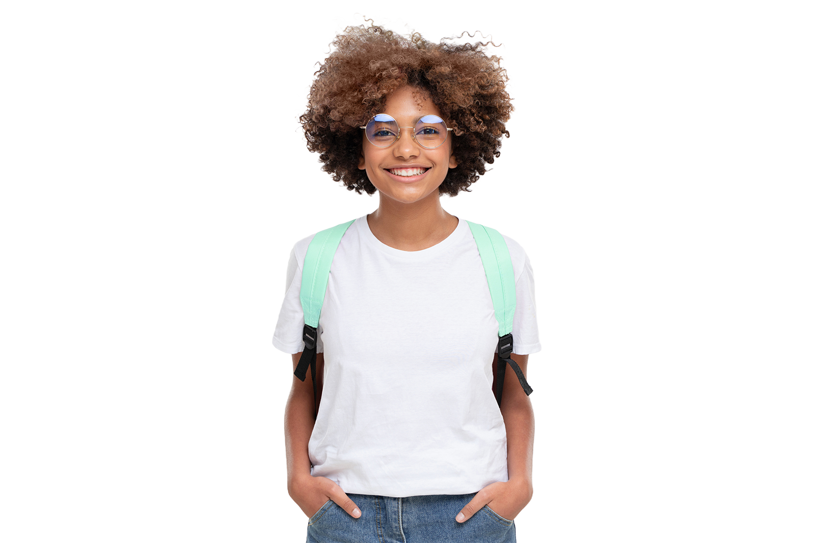 Smiling teenage girl with glasses and wearing a backpack with her hands in her pockets