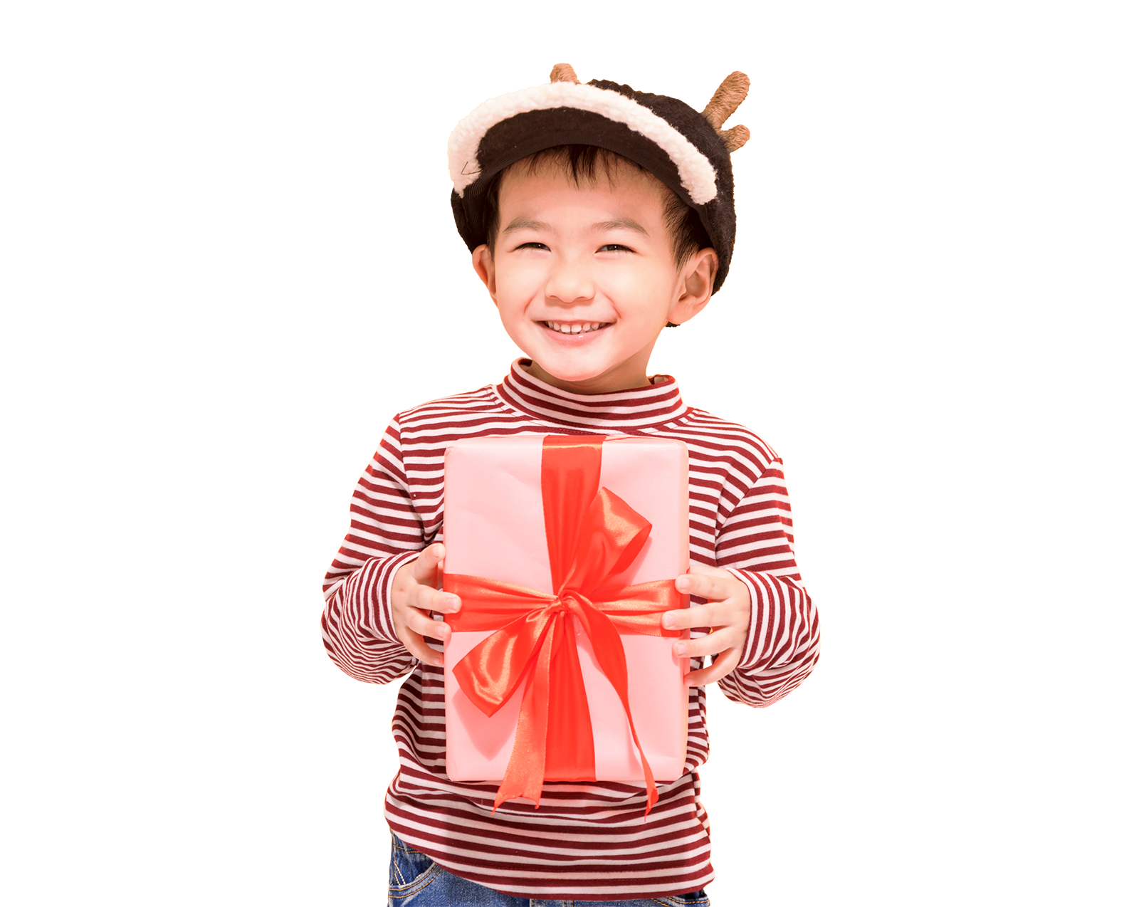 Young boy wearing a reindeer hat smiling while holding a gift