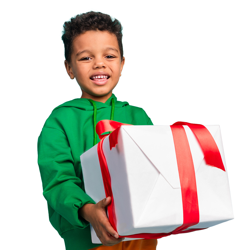 A young boy joyfully holds a large gift box, showcasing excitement and anticipation for what’s inside.